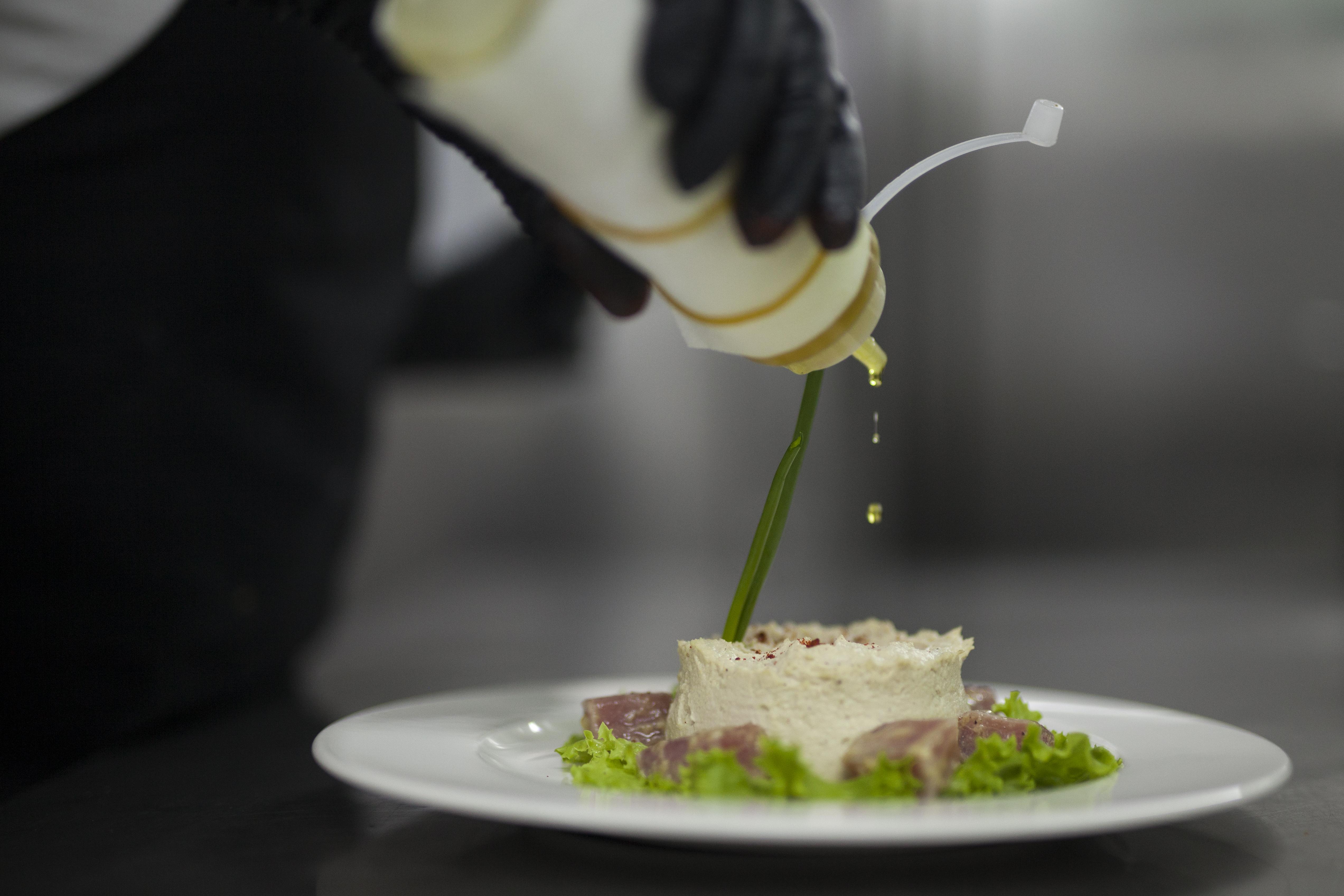 Grand Hotel Yerevan - Small Luxury Hotels Of The World 외부 사진 A chef finishing a dish